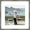 Vietnamese Woman Carrying Baskets Of Framed Print