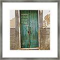 Weathered Green Door Of Serpa Framed Print