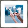Woman Checking Financial Trading Data With Smartphone In City Framed Print