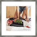 Woman Packing Suitcase On Bed Framed Print
