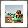 Young Boy With Goggles Imagines Flying On Suitcase Framed Print