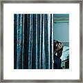 Young Male Doctor Sitting On Hospital Bed With Head In Hands Framed Print
