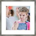 Young Schoolgirl Mimics Face On Emotion Flash Card Framed Print
