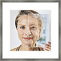 Young Woman Holding Picture Of Elderly Woman Framed Print