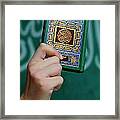 Boy's Hand Holding Koran Framed Print