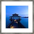 Building At The End Of A Jetty During Twilight Framed Print