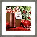 Christmas Gift Sitting On A Table Framed Print