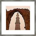 Cross Section Of The Qutub Minar Framed Within An Archway In Foggy Weather Framed Print