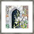 Hollyhocks By Doorway Framed Print