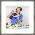 Hungry Boy Eating Lot Of Cake Framed Print