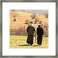 Priest And Nun In The Monastery Yard Framed Print