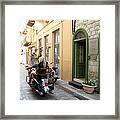 Girl Riding On Motorcycle With Handsome Bike Rider Speed Stone Paved Street In Nafplion Greece Framed Print