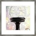 Snowglobe With Ornaments Against Colored Background Framed Print