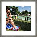 A Fit Austin Woman Sunbathes In A Bikini At Deep Eddy Pool, Surrounded By Grassy Slopes Which Are The Best In Austin For Sunbathing Framed Print