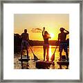 A Group Of Friends, Silhouetted By The Sunset, Exercise On Stand-up Paddle Boards On Lady Bird Lake In Austin, Texas Framed Print