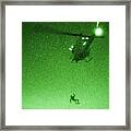 A U.s. Marine Rappels From A Uh-1n Huey Helicopter Framed Print