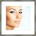 Beautiful Female Face Over Abstract Blue Sky Background Framed Print