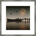 Boat On A Lake With Geese Flying Over Framed Print