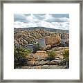 Boulders By The Dam Framed Print