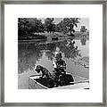 Boy With Dog In Fishing Boat Framed Print