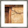 Cracked Lime Stone Wall And Detail Of An Old Wooden Door Framed Print