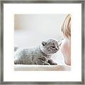 Cute Little Cat And Woman Rubbing Noses. Framed Print