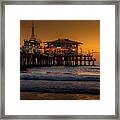 Daylight Turns Golden On The Pier Framed Print