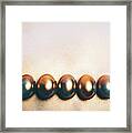 Five Golden Eggs Laying On The Floor. Framed Print