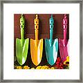 Four Colored Trowels Framed Print