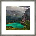Grinnell Lake Shining Under The Storm Framed Print