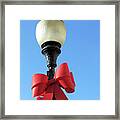 Lamp Post With Red Bow Framed Print