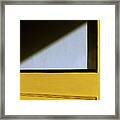 Light Triangle On Yellow Door Framed Print