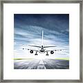 Passenger Airplane Taking Off On Runway Framed Print