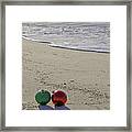 Red And Green Bulbs In The Surf Verticle Framed Print