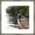 Red Canoe At Shoreline With Trees Framed Print