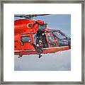 Rescue Swimmer Jumps From Helicopter Framed Print