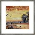 Sunset On The Marshes With Cranes Framed Print