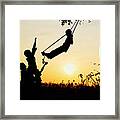 Sunset Silhouette Swing Framed Print