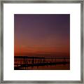 The Sun Sets Over The Water Framed Print