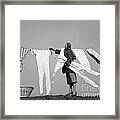 Woman Removing Frozen Clothes Framed Print