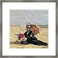 Woman With A Parasol On The Beach Framed Print