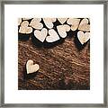 Wooden Hearts On Dark Wooden Background Framed Print
