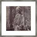 Young Man In White Robe And Head Gear Holding Scabbard Framed Print