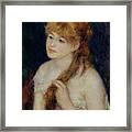 Young Woman Braiding Her Hair Framed Print