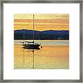 Boat On A Lake At Sunset Framed Print