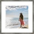 Rear View Of A Young Woman On A Beach Framed Print