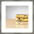 A Stack Of Four Gold Ingots Framed Print