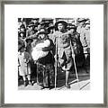 Amputee Soldier Watching Parade Framed Print