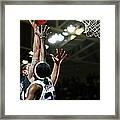 Basketball Player Dunking The Ball Over Framed Print