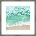 Bathers Swimming On Isolated Beach Framed Print